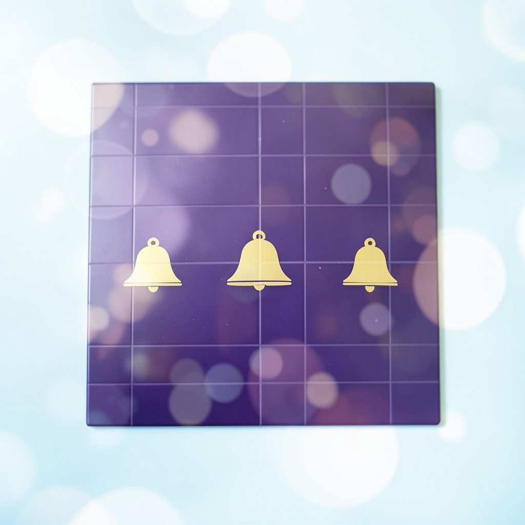Dark violet tile with golden bell symbols and soft bokeh light effects, classic casino elegance.